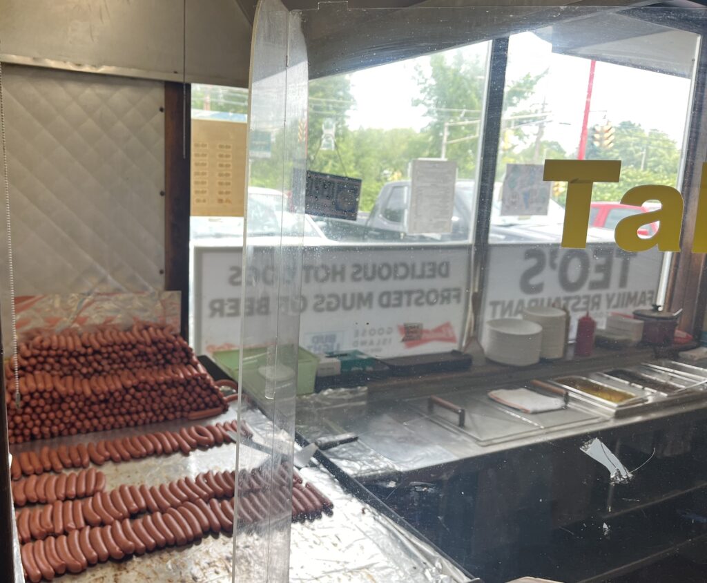 Photo of hot dogs on a grill