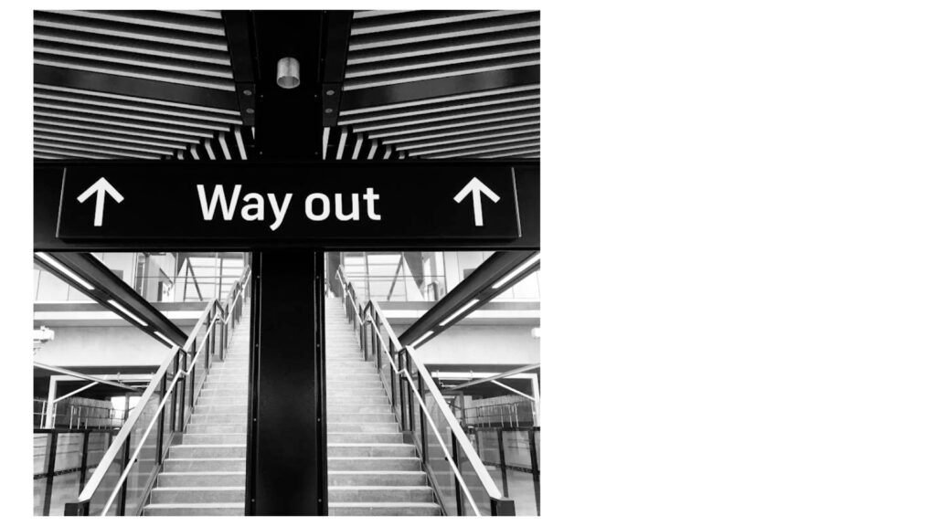 Image of a sign that says way out